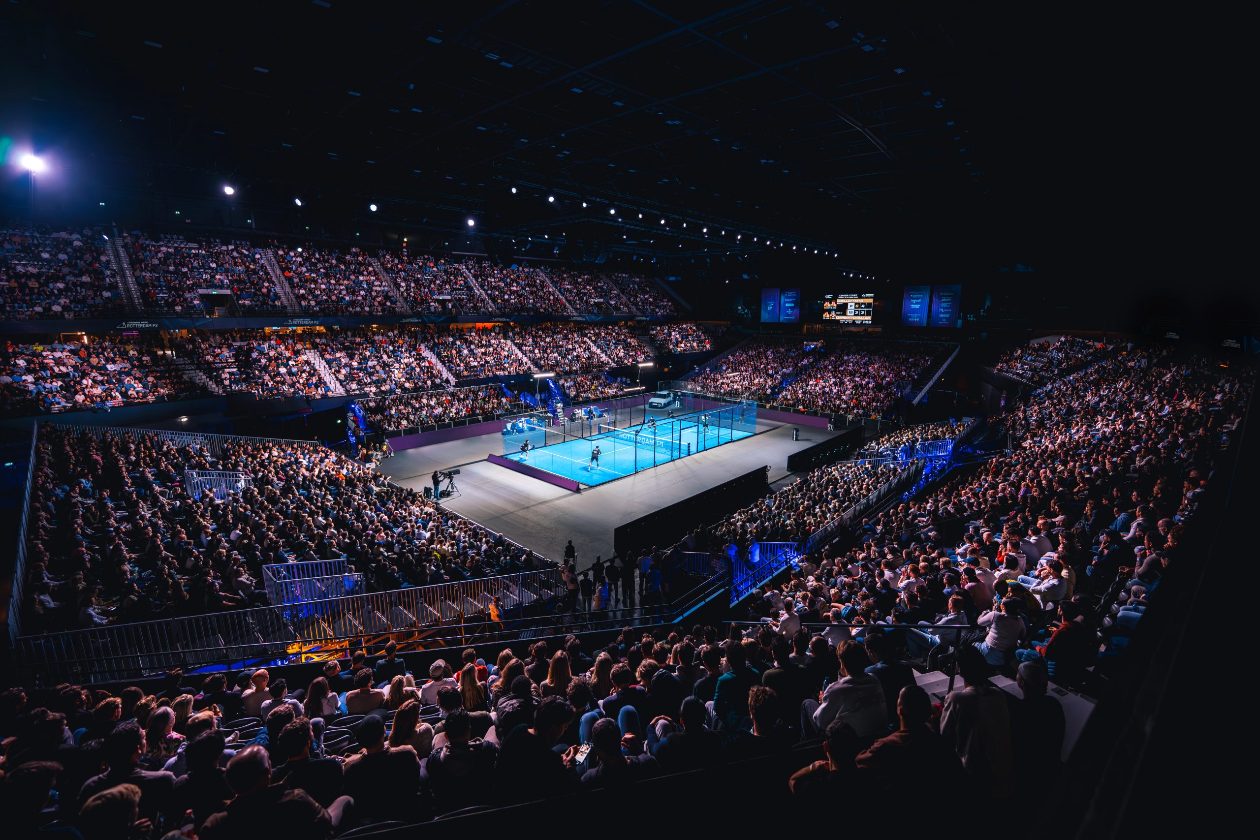 A packed Ahoy Rotterdam arena surrounding the blue Premier Padel court